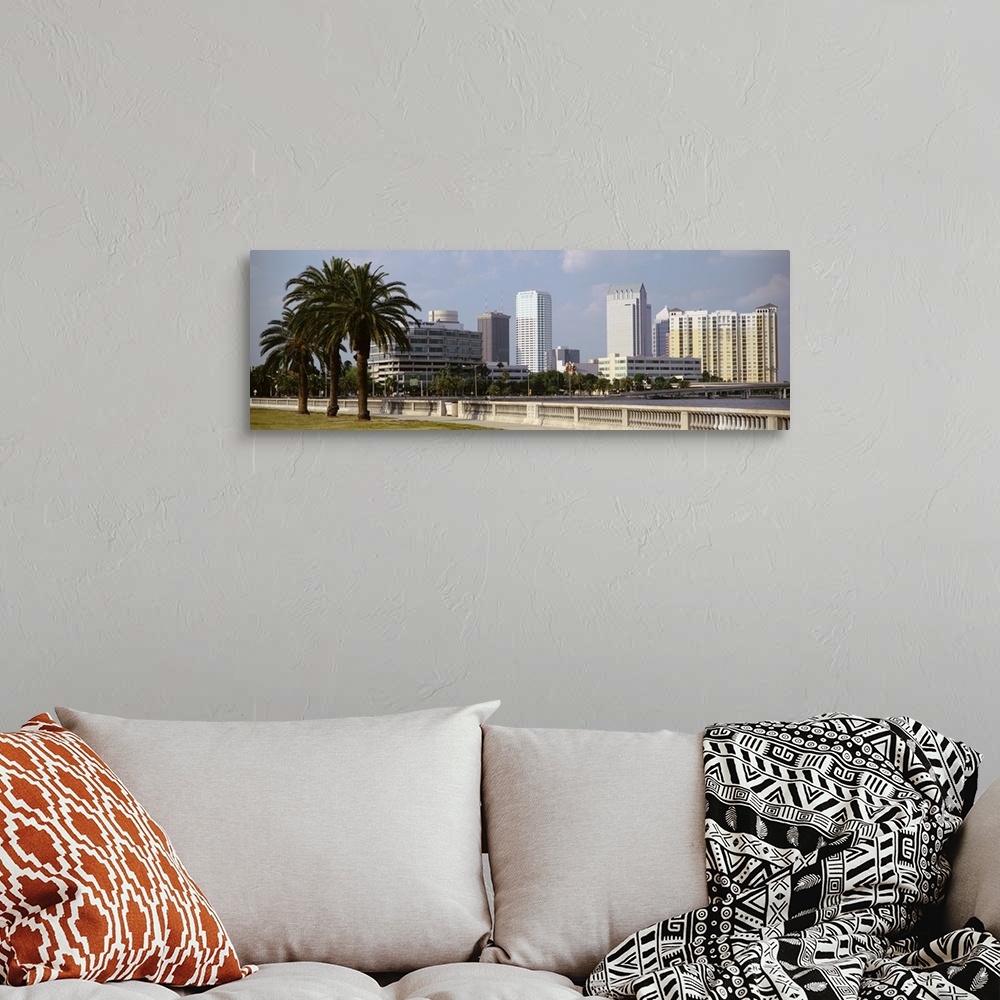 A bohemian room featuring The skyline in Tampa is photographed from across the body of water that sits in front of it. Larg...