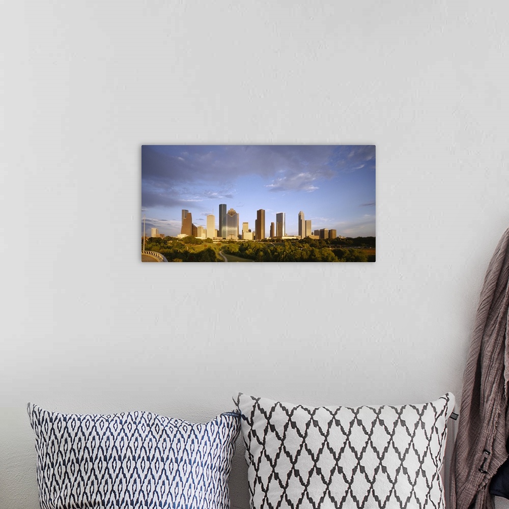 A bohemian room featuring Skyscrapers against cloudy sky, Houston, Texas, USA