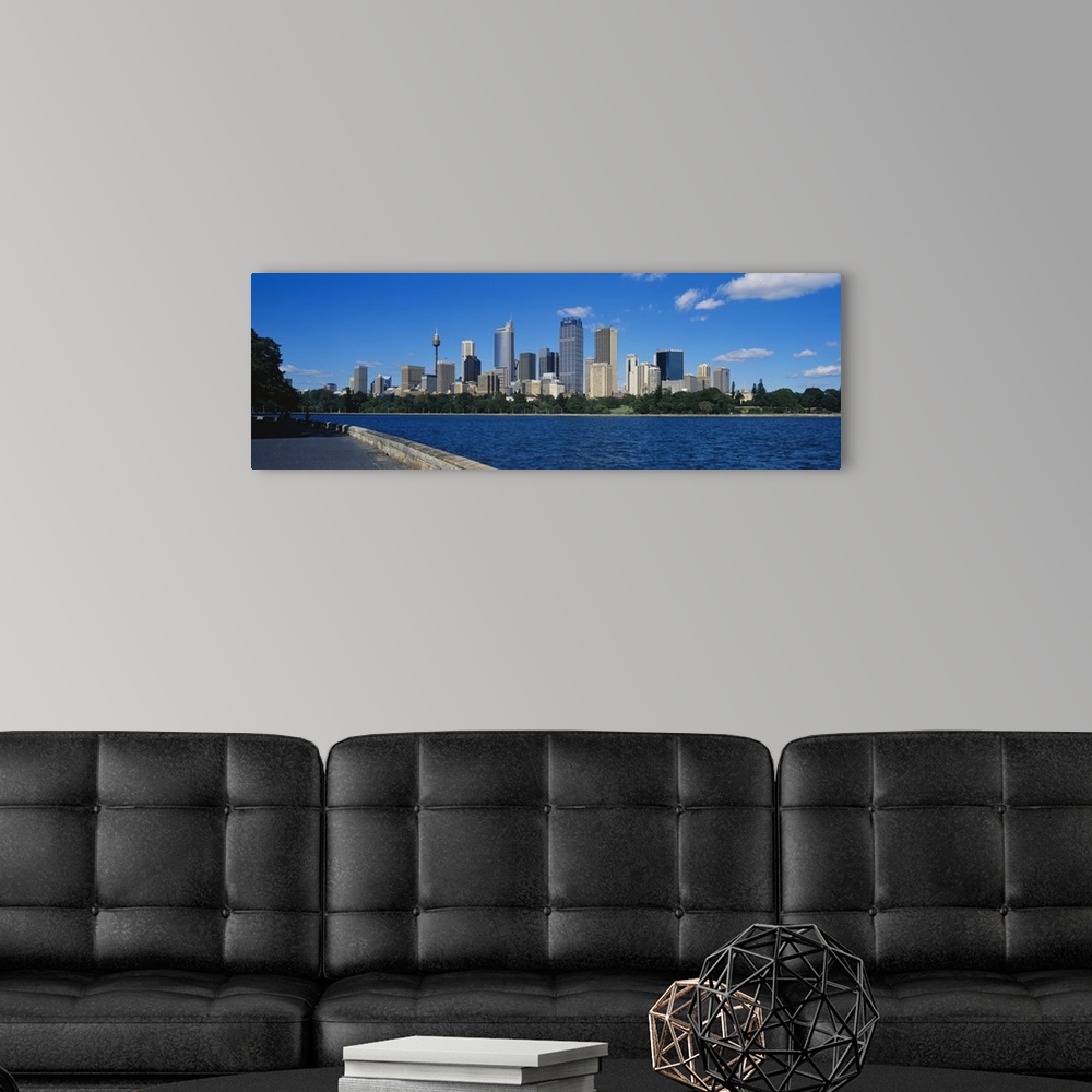 A modern room featuring Skyscrapers along a waterfront, Sydney, Australia