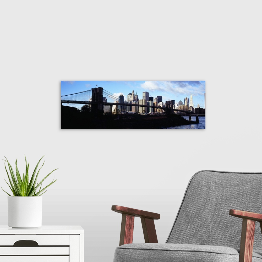 A modern room featuring Skyscrapers at the waterfront, Brooklyn Bridge, East River, Manhattan, New York City, New York State