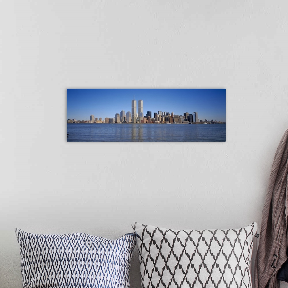 A bohemian room featuring Panoramic, distant photograph of the New York City skyline including the World Trade Center, refl...