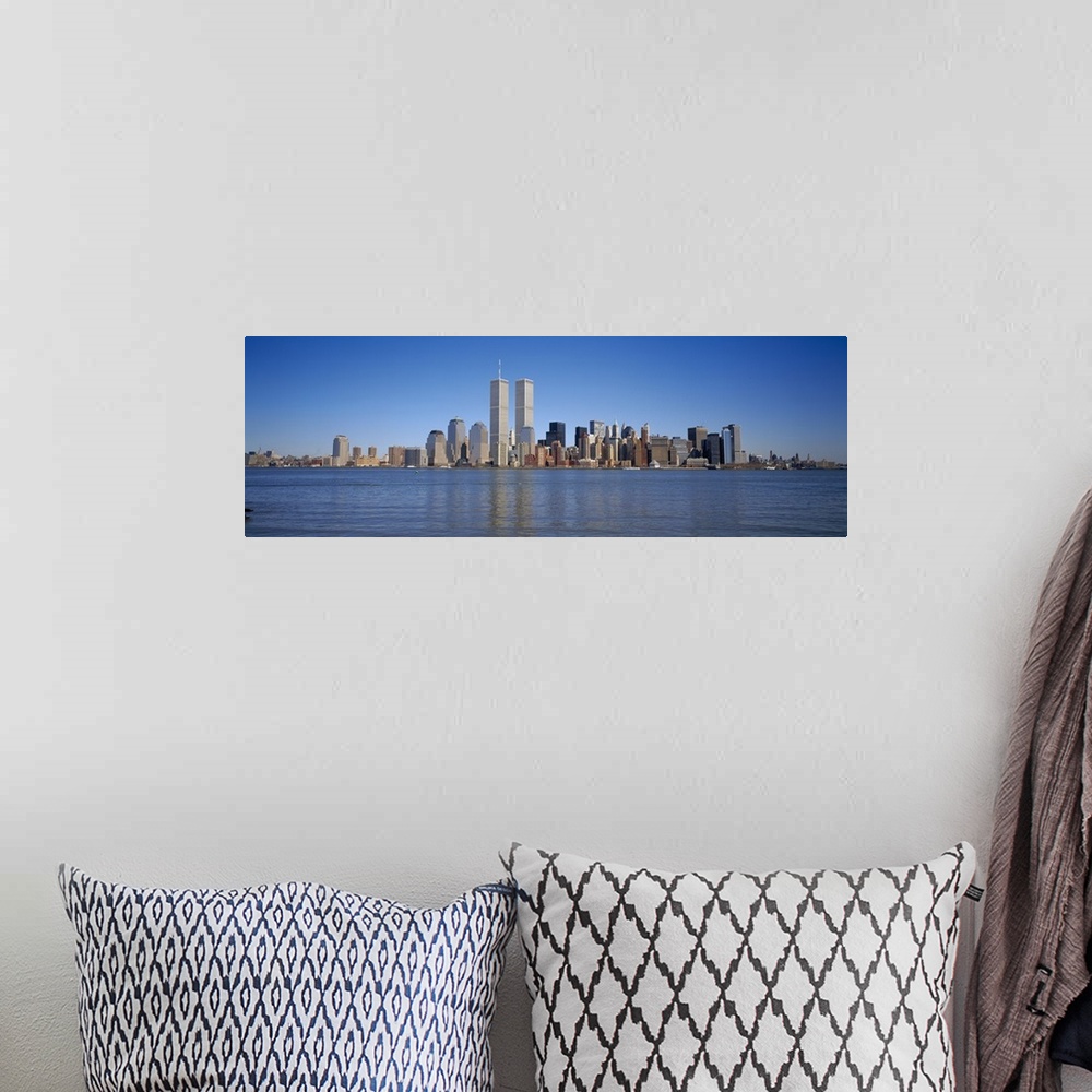 A bohemian room featuring Panoramic, distant photograph of the New York City skyline including the World Trade Center, refl...