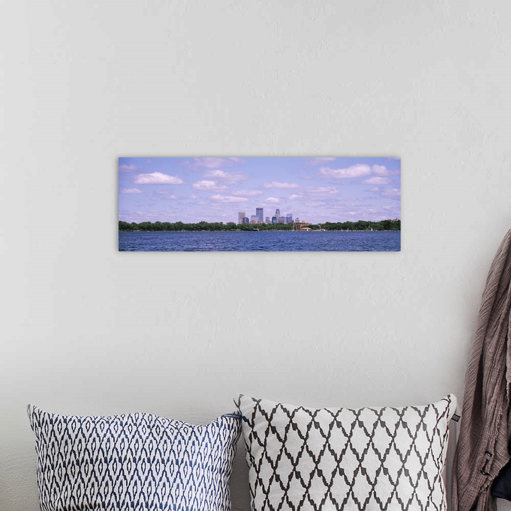 A bohemian room featuring Panorama depicting Minneapolis downtown with a cloud-filled sky and a view of Chain of Lakes Park...