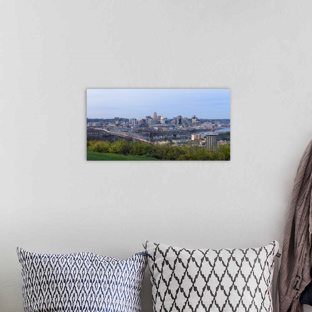 A bohemian room featuring Horizontal, distant photograph of bridges and skyscrapers of the Cincinnati, Ohio skyline, grass ...