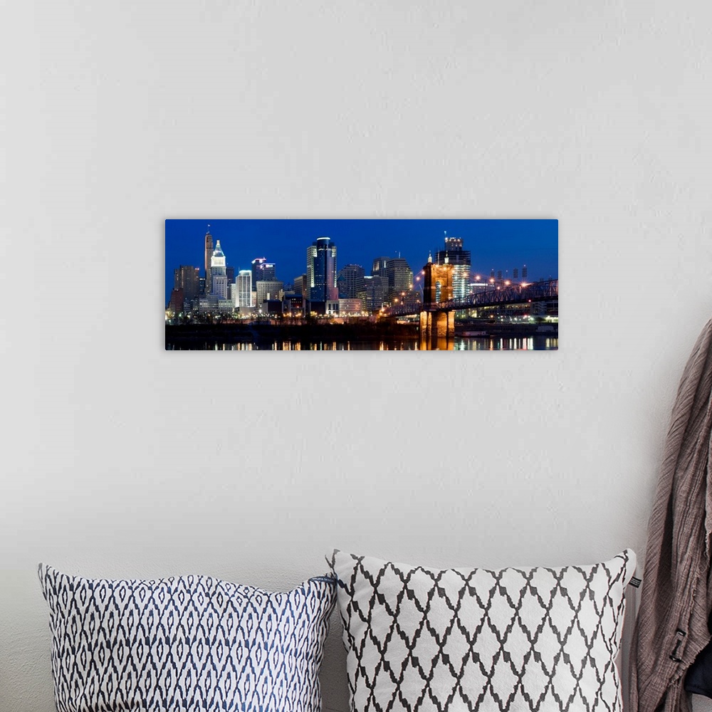 A bohemian room featuring Tall buildings reflecting in the water of the Ohio River in this panoramic landscape canvas.