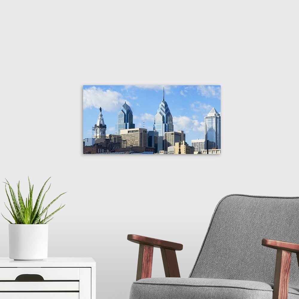 A modern room featuring An urban landscape photograph of the city skyline taken from ground level.
