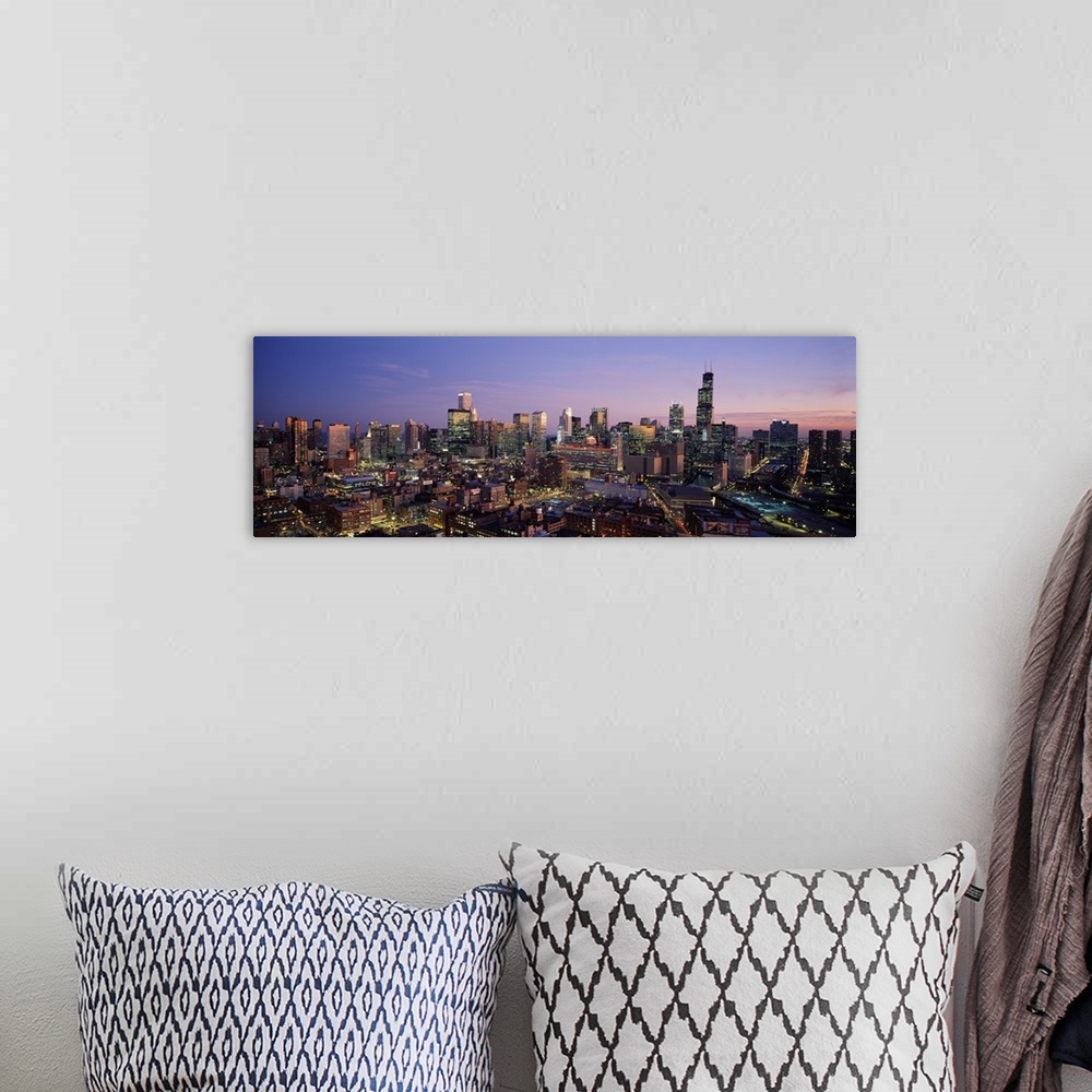 A bohemian room featuring Skyscrapers in a city lit up at dusk, Chicago, Illinois