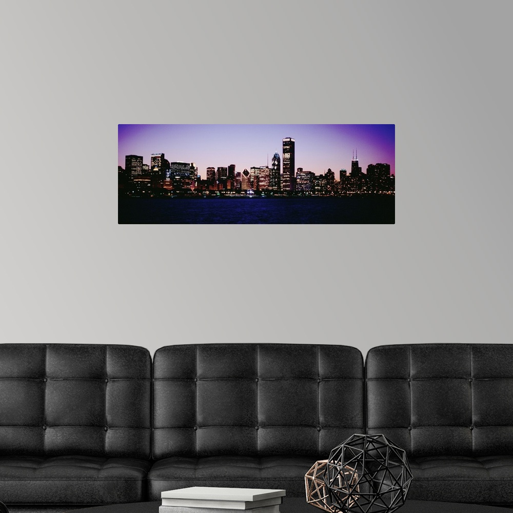A modern room featuring Skyscrapers in a city lit up at dusk, Chicago, Illinois