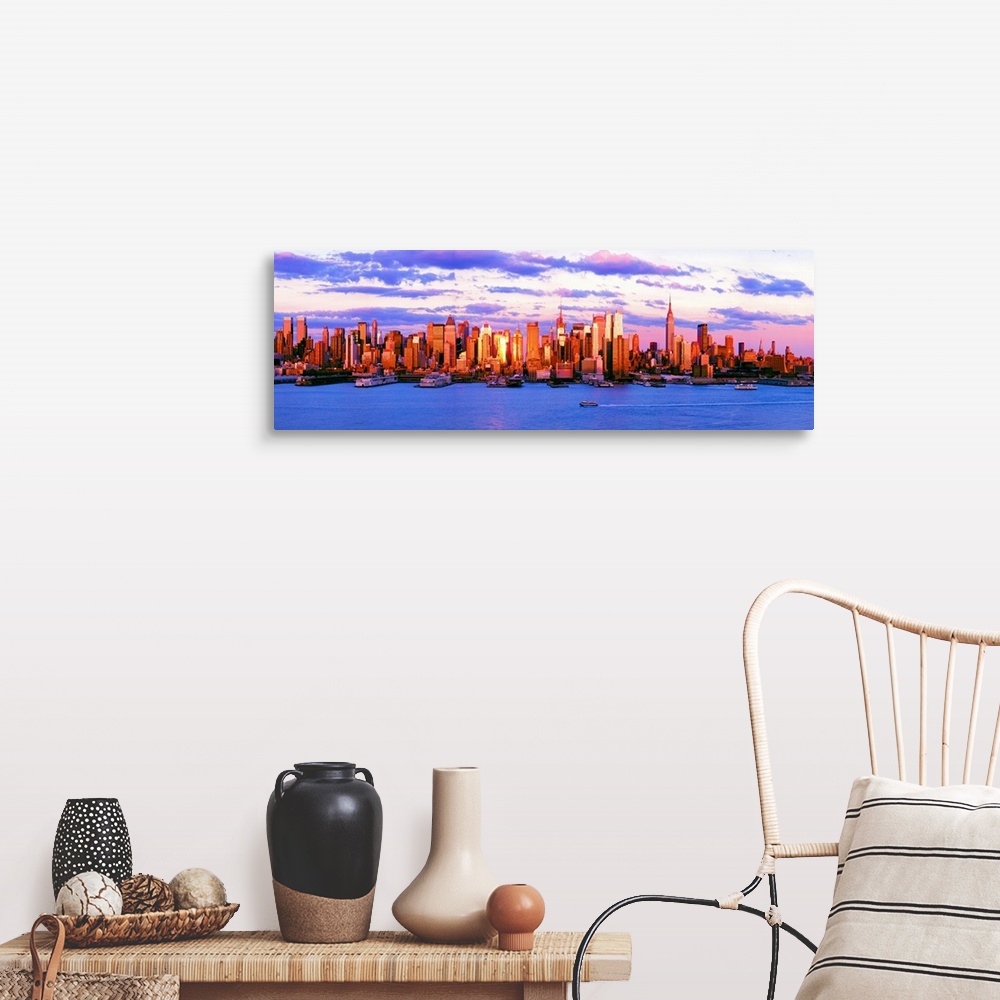 A farmhouse room featuring Panoramic photograph of the water in front of the New York City skyline, beneath a vibrant, partl...