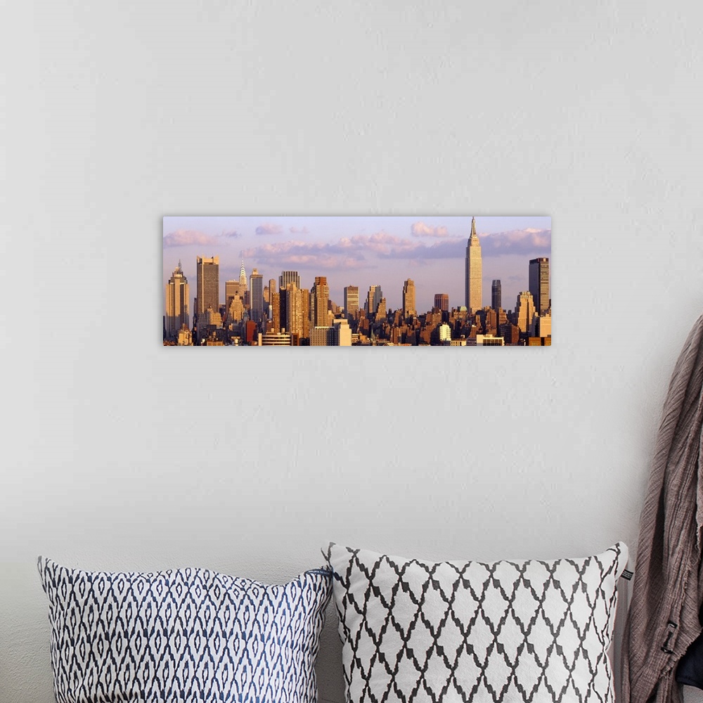 A bohemian room featuring Panoramic photograph of the "Big Apple" skyline under cloudy skies.