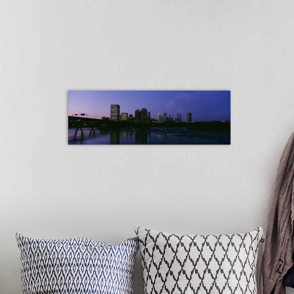 A bohemian room featuring This decorative wall art for the home or office is a panoramic photograph of the city downtown ta...
