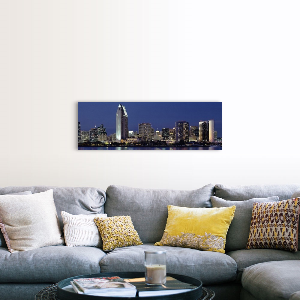 A farmhouse room featuring This large panoramic photograph is of the San Diego skyline at night with all of the buildings li...