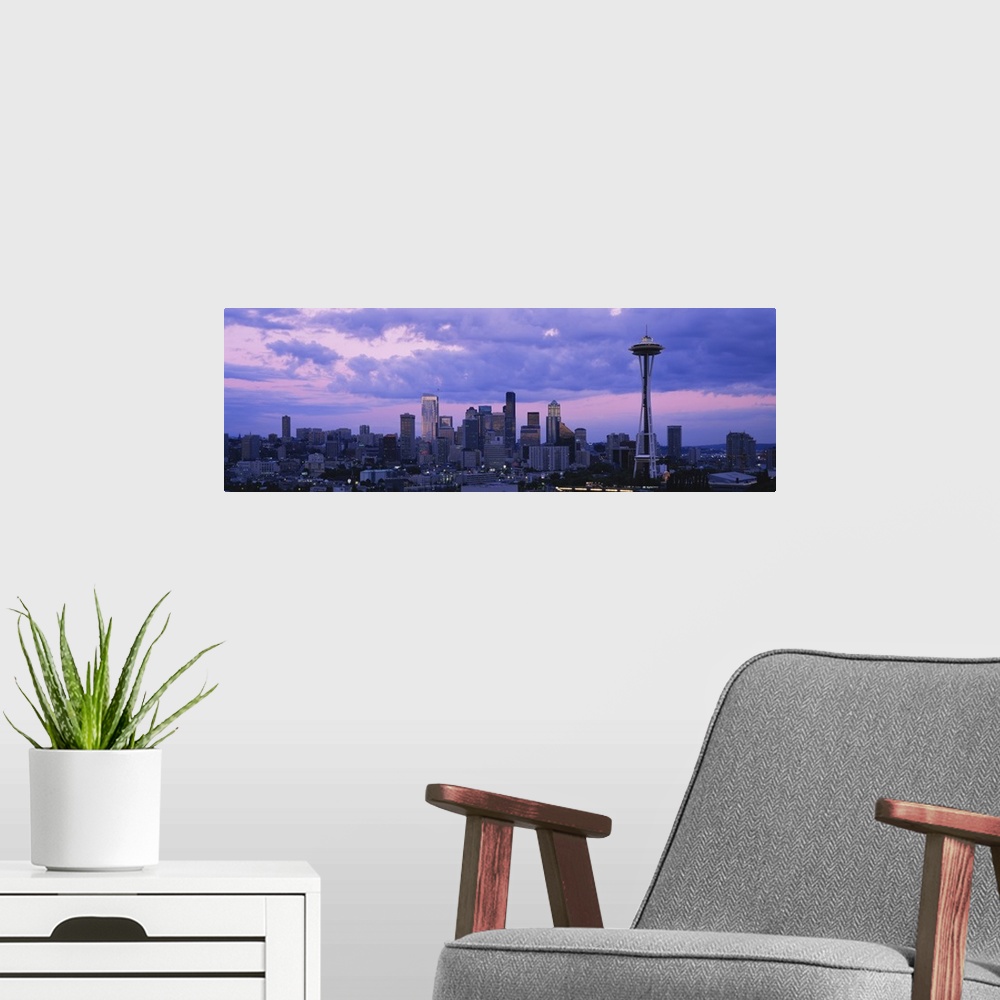 A modern room featuring Panoramic cityscape photo of a major Pacific Northwest city with the Space Needle on the right.