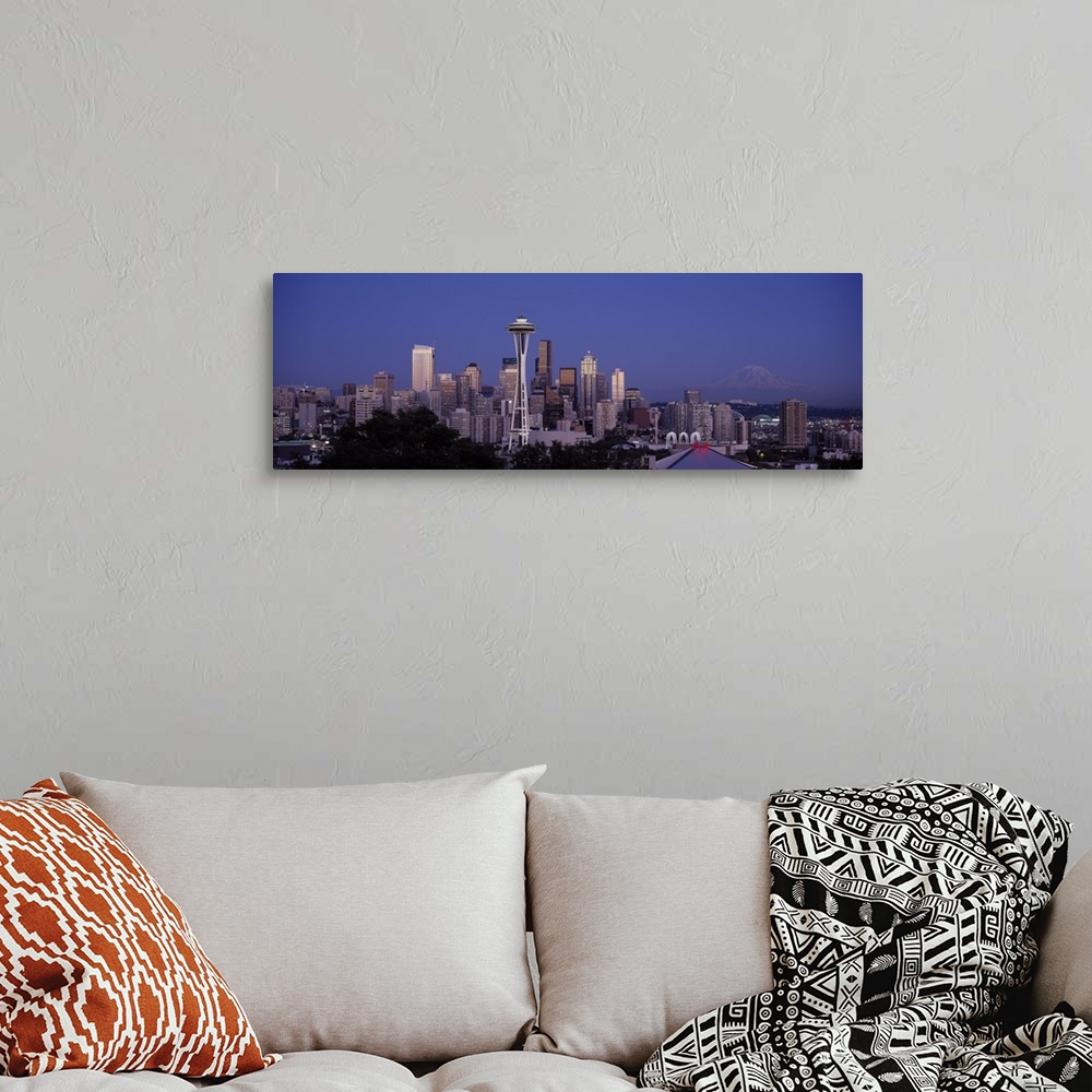 A bohemian room featuring A panoramic view of the Seattle skyline with the space needle focused in the middle.