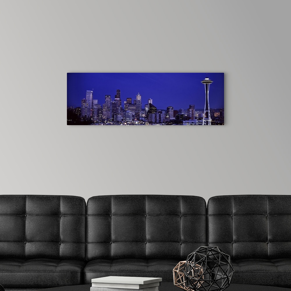 A modern room featuring Panoramic photograph of skyline at night with buildings lit up.  Iconic buildings such as the Spa...