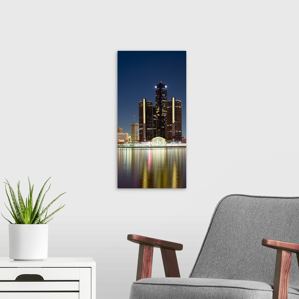 A modern room featuring Skyscrapers lit up at dusk, Renaissance Center, Detroit River, Detroit, Michigan,