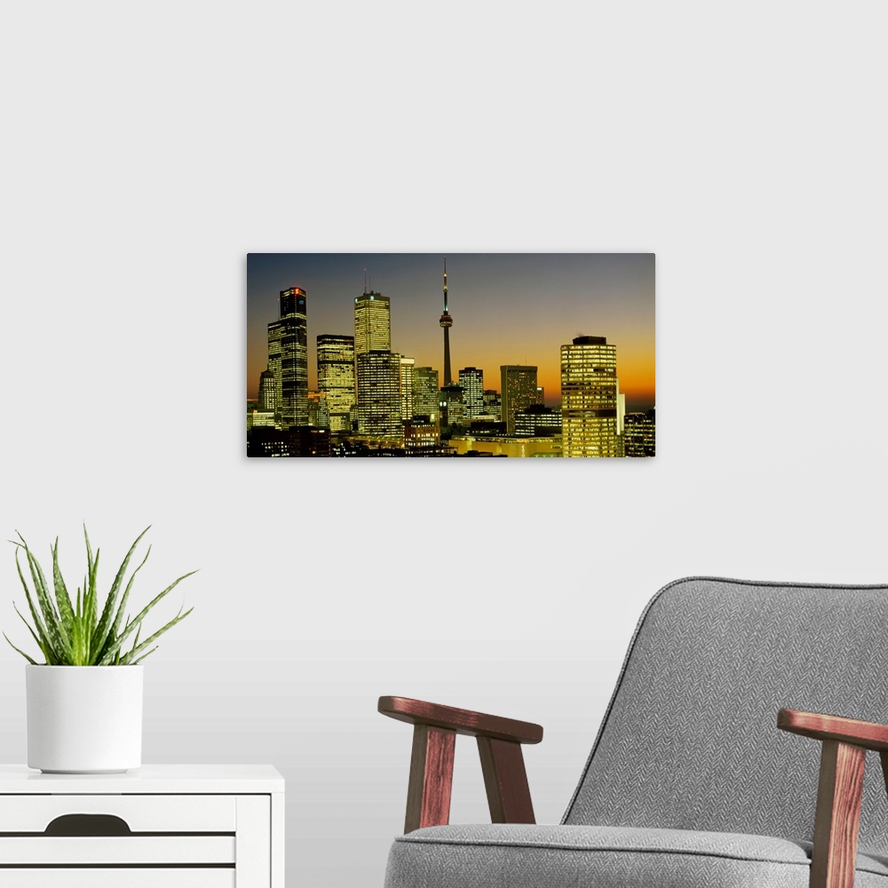 A modern room featuring Photograph of brightly lit buildings at night in Toronto, Canada, featuring Toronto Eaton Centre ...