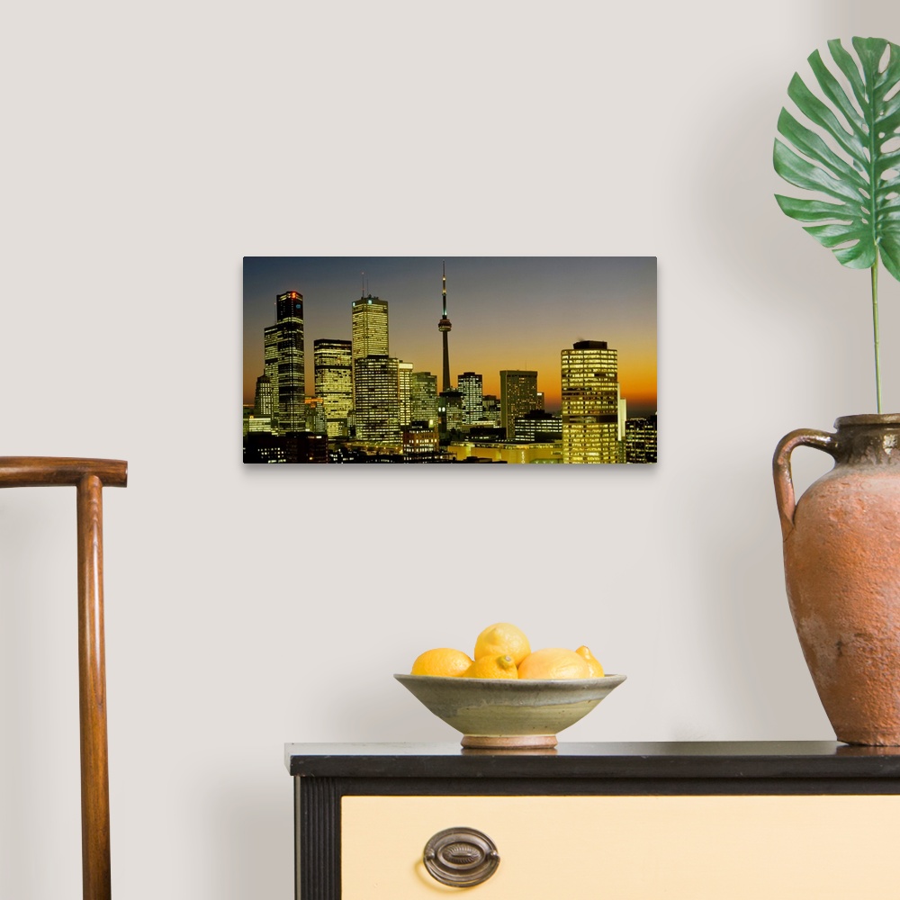 A traditional room featuring Photograph of brightly lit buildings at night in Toronto, Canada, featuring Toronto Eaton Centre ...