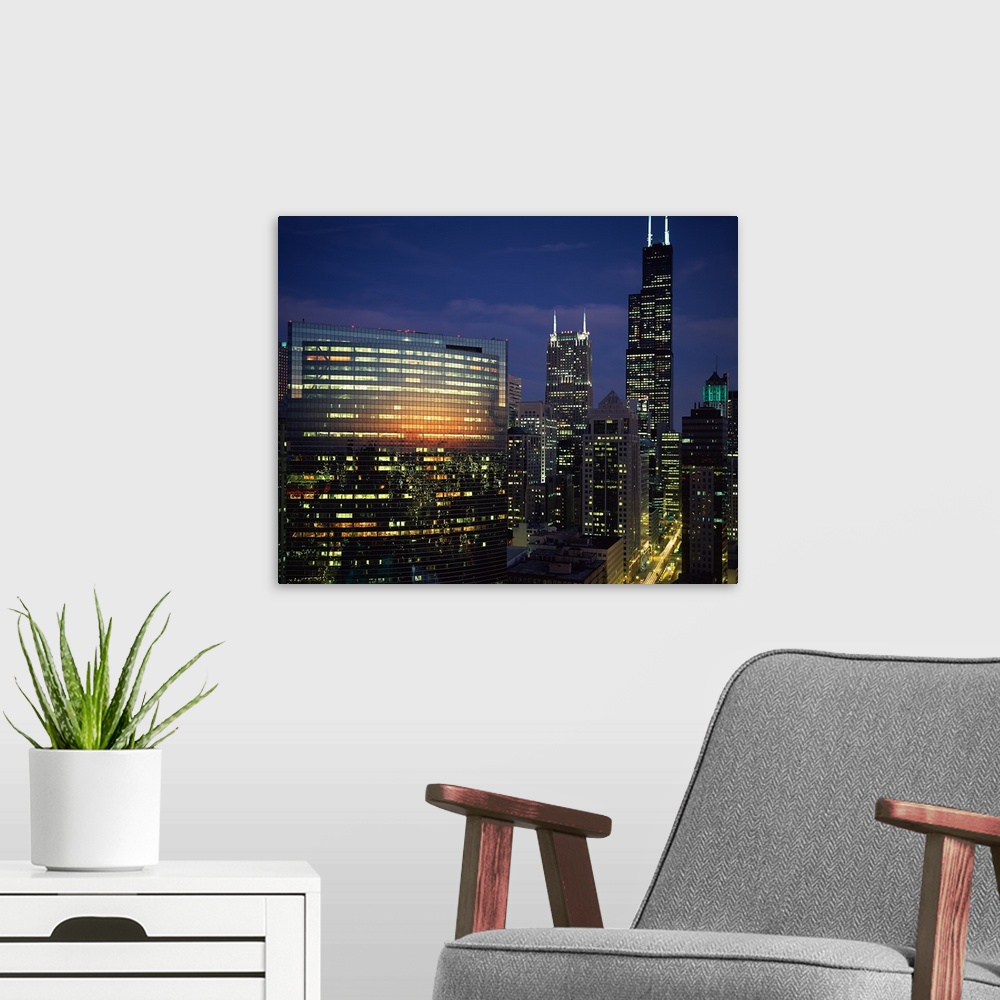 A modern room featuring Skyscrapers lit up at night, Chicago, Cook County, Illinois,