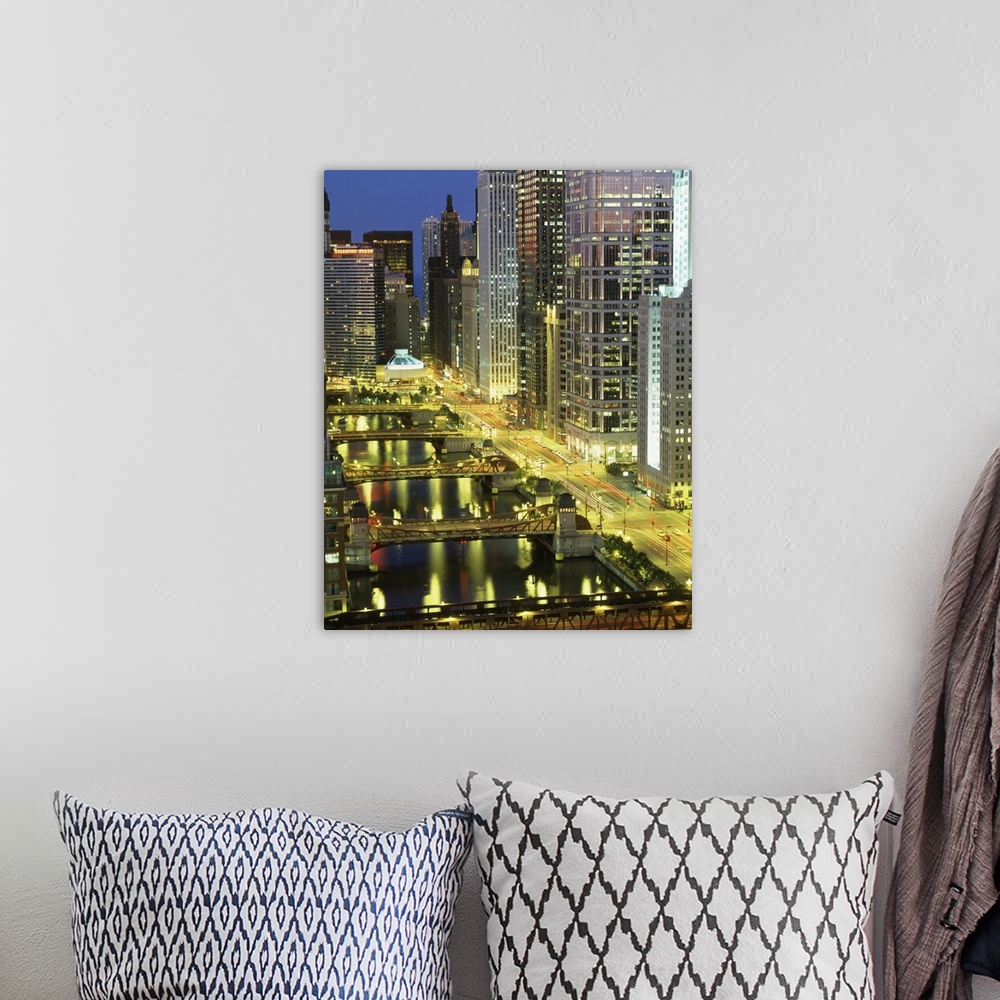 A bohemian room featuring Big photograph shows an aerial view overlooking groups of skyscrapers found within a busy Midwest...