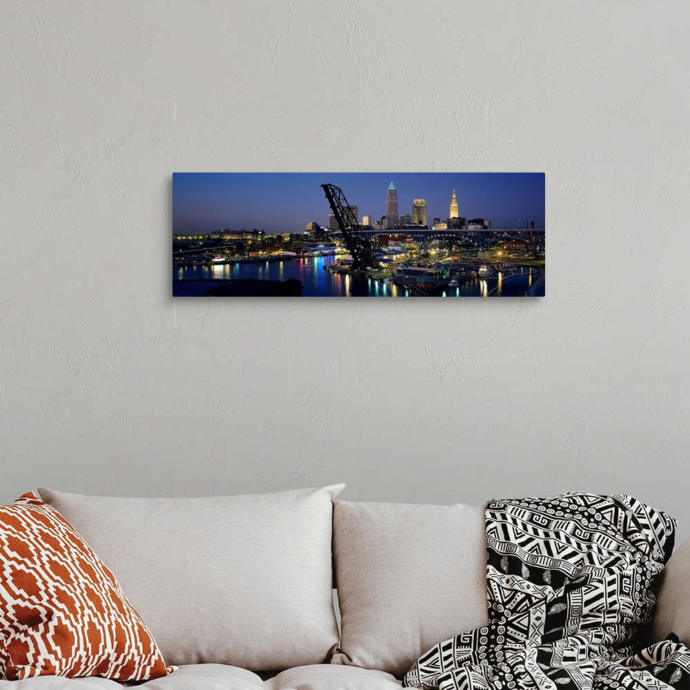 A bohemian room featuring This is a panoramic photograph showing the downtown of the city and a river harbor with a raised ...