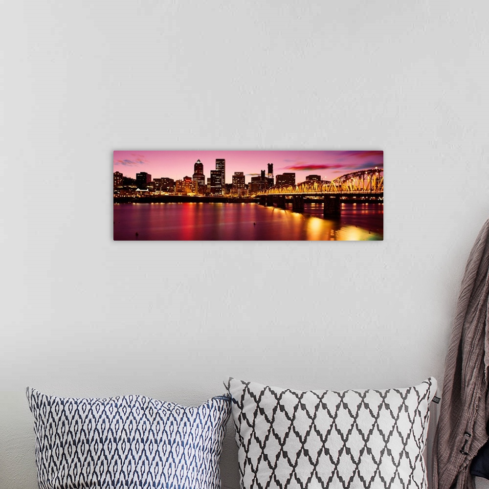 A bohemian room featuring A panoramic city scape photograph of the downtown area photograph from across the river.