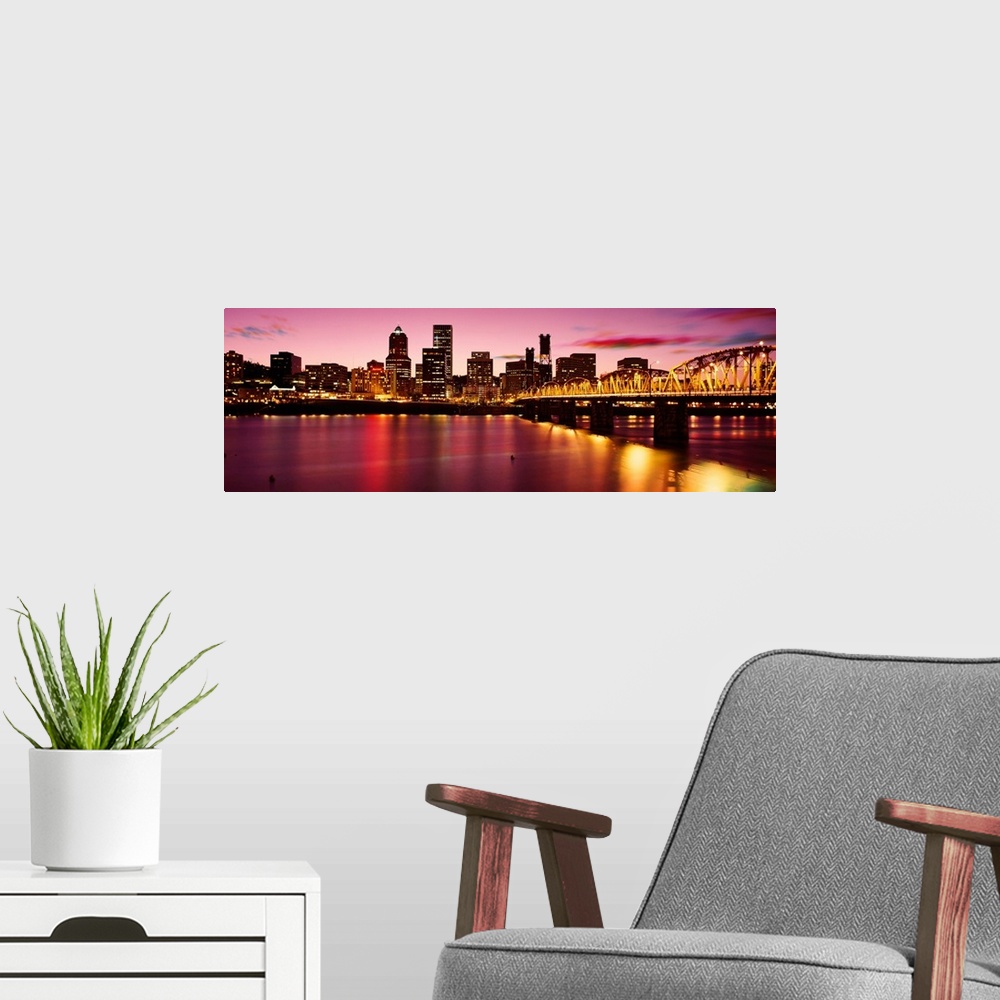 A modern room featuring A panoramic city scape photograph of the downtown area photograph from across the river.