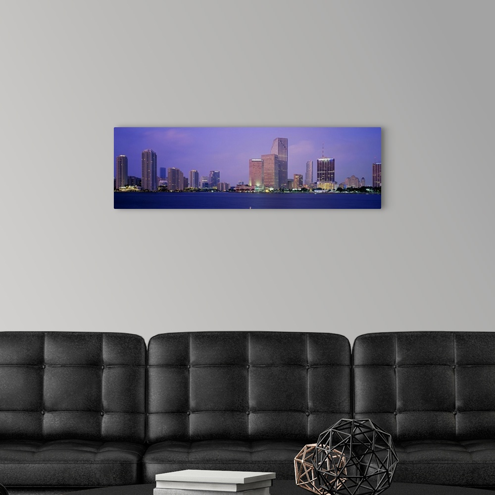 A modern room featuring Skyscrapers on the waterfront at dusk, Miami, Florida