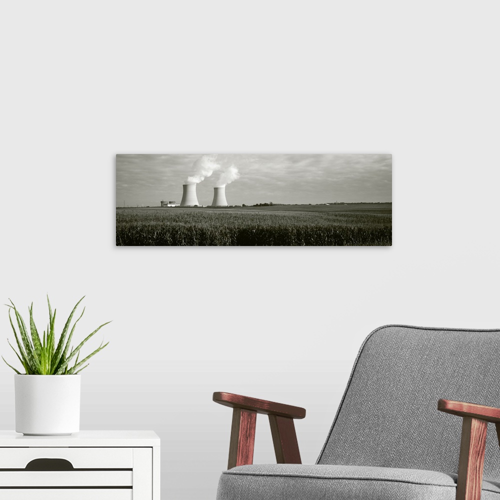 A modern room featuring Smoke emitting from two smoke stacks, Byron Nuclear Power Station, Ogle County, Illinois