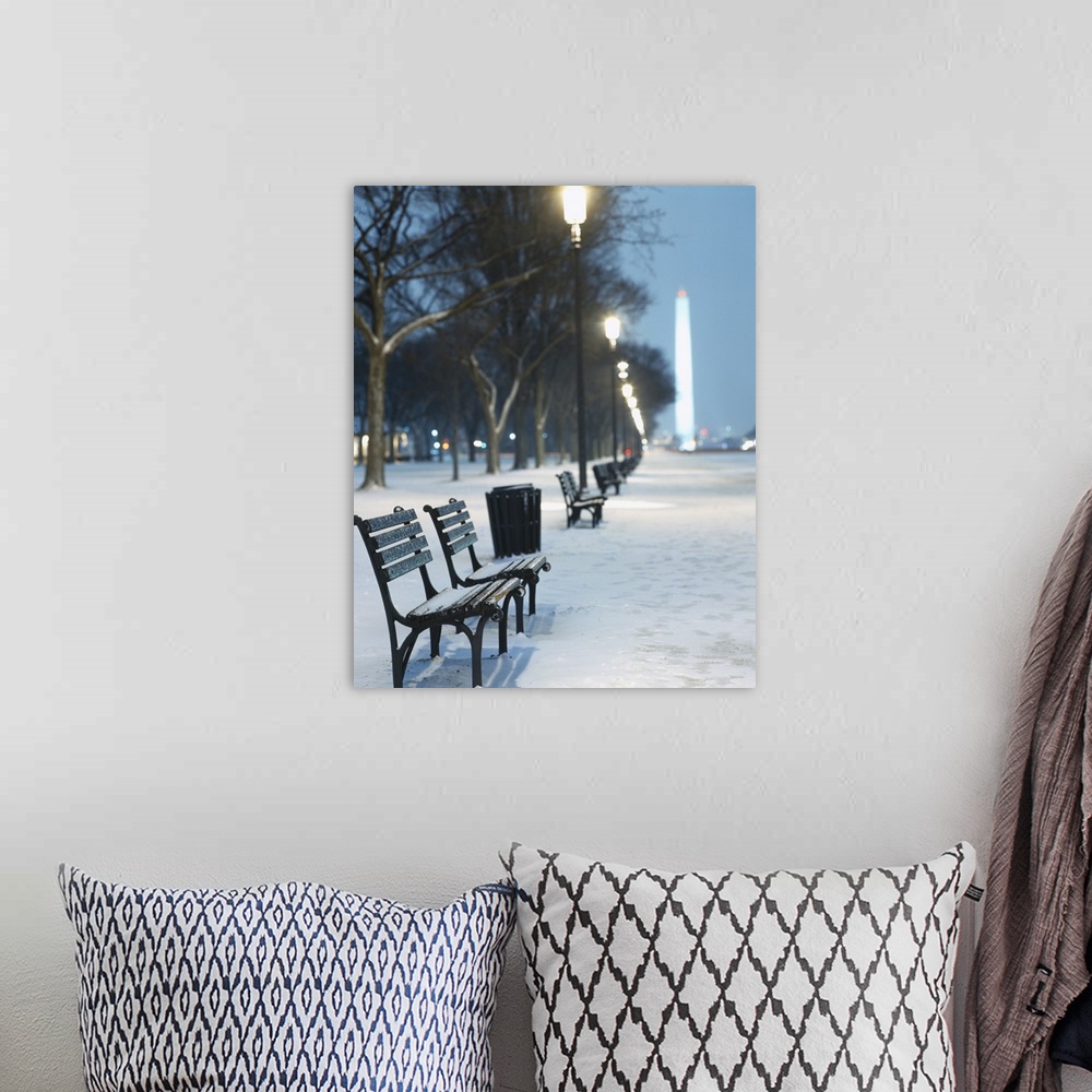 A bohemian room featuring Snow covers the National Mall and rows of out of focus benches and street lights in this vertical...