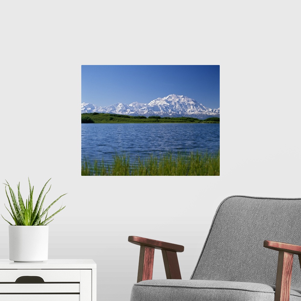 A modern room featuring Snow-covered Mount McKinley, mountain lake, blue sky, Denali National Park, Alaska