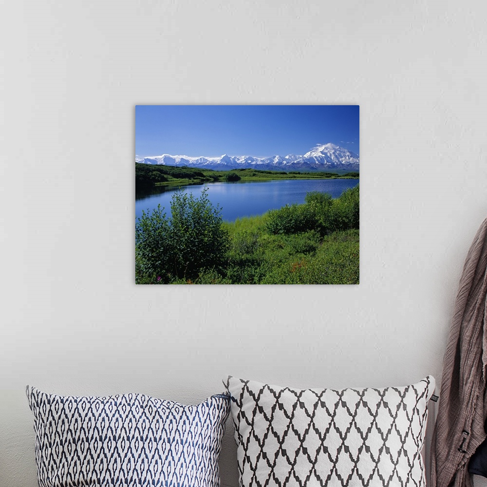 A bohemian room featuring Snow-covered Mount McKinley, mountain lake, blue sky, Denali National Park, Alaska