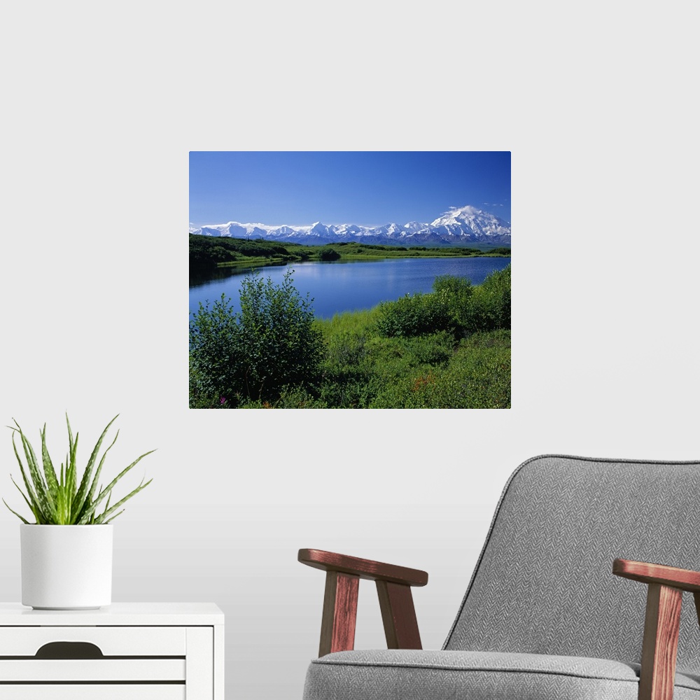 A modern room featuring Snow-covered Mount McKinley, mountain lake, blue sky, Denali National Park, Alaska