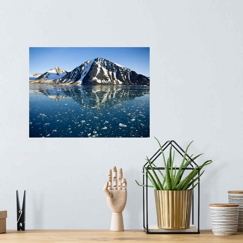 A bohemian room featuring Snow covered mountain reflecting in water, Liefdefiorden, Spitsbergen, Svalbard, Norway