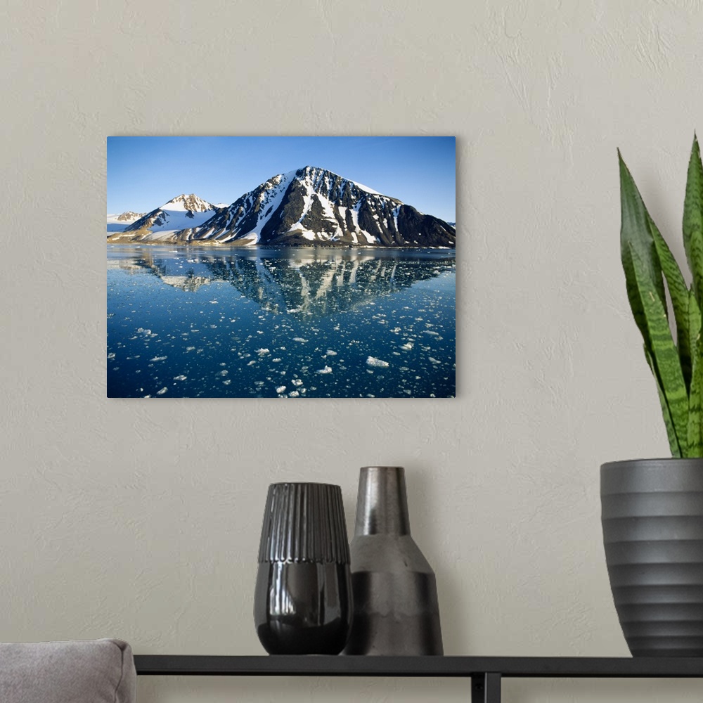 A modern room featuring Snow covered mountain reflecting in water, Liefdefiorden, Spitsbergen, Svalbard, Norway