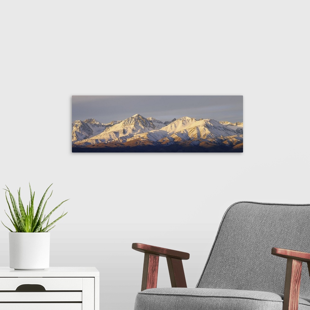 A modern room featuring Snow covered mountains on a landscape, Californian Sierra Nevada, California