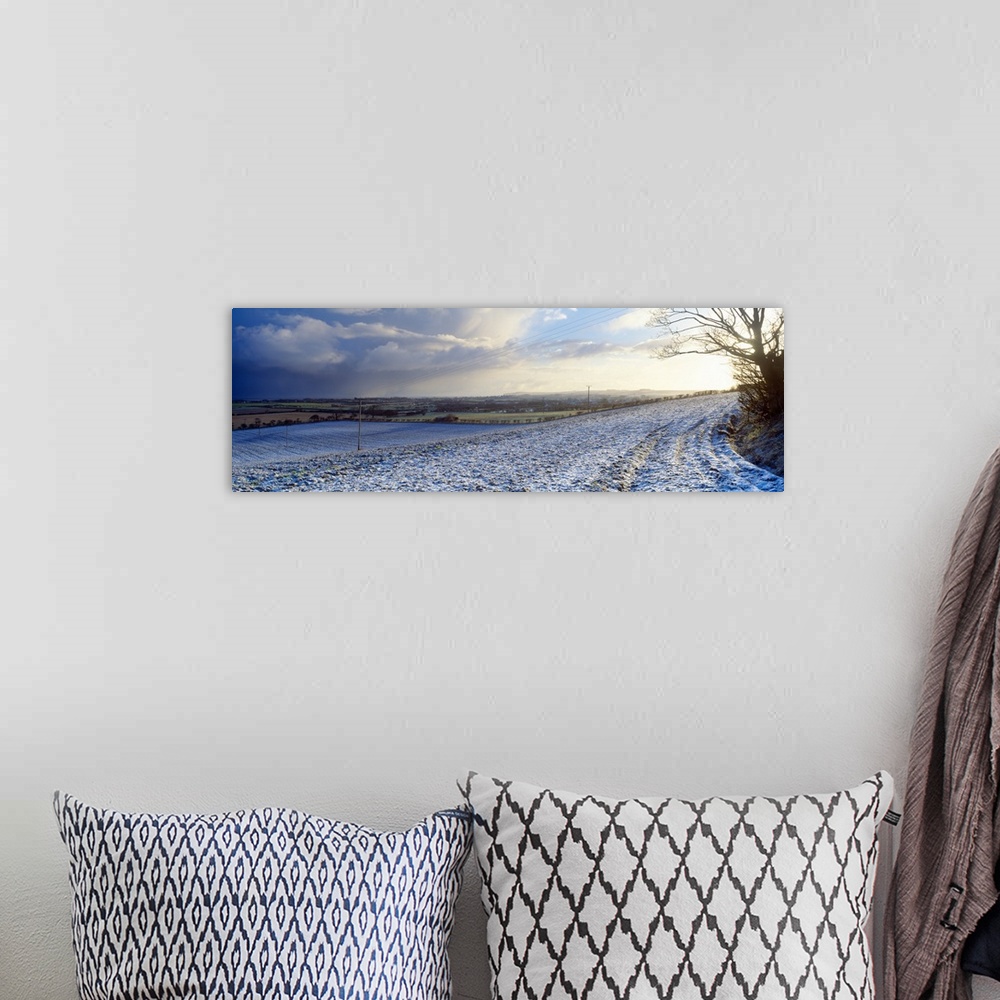 A bohemian room featuring Snow covered road passing through a landscaped, Bempton, East Riding of Yorkshire, England
