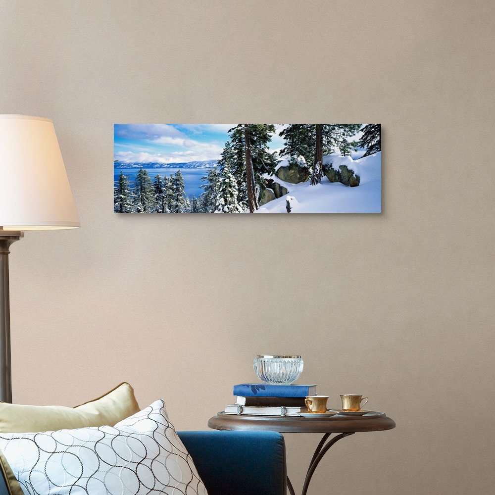 A traditional room featuring A landscape photograph taken from a mountain ridge in winter looking down into the scenic lake an...