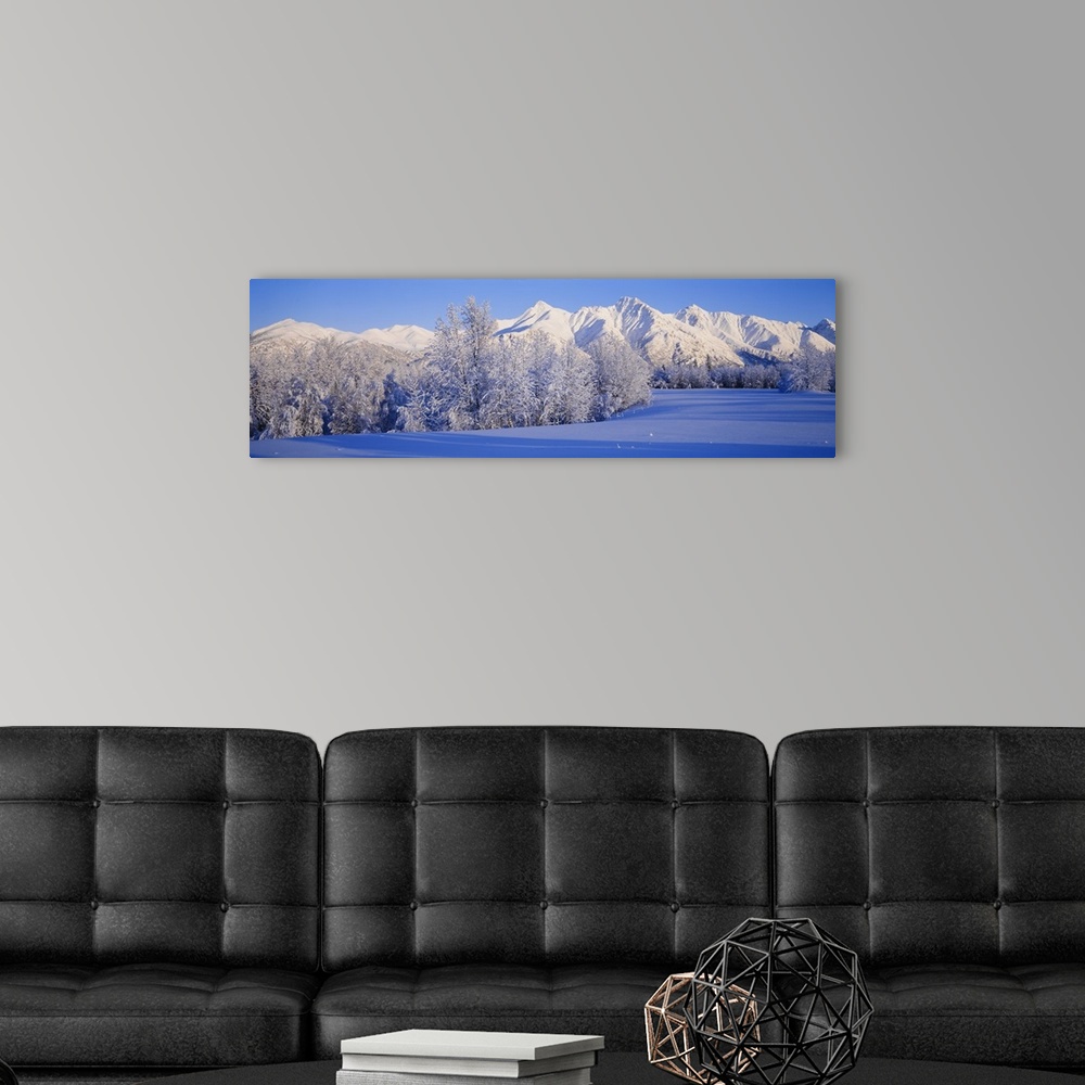A modern room featuring Snowcapped mountains on a landscape, Alaska
