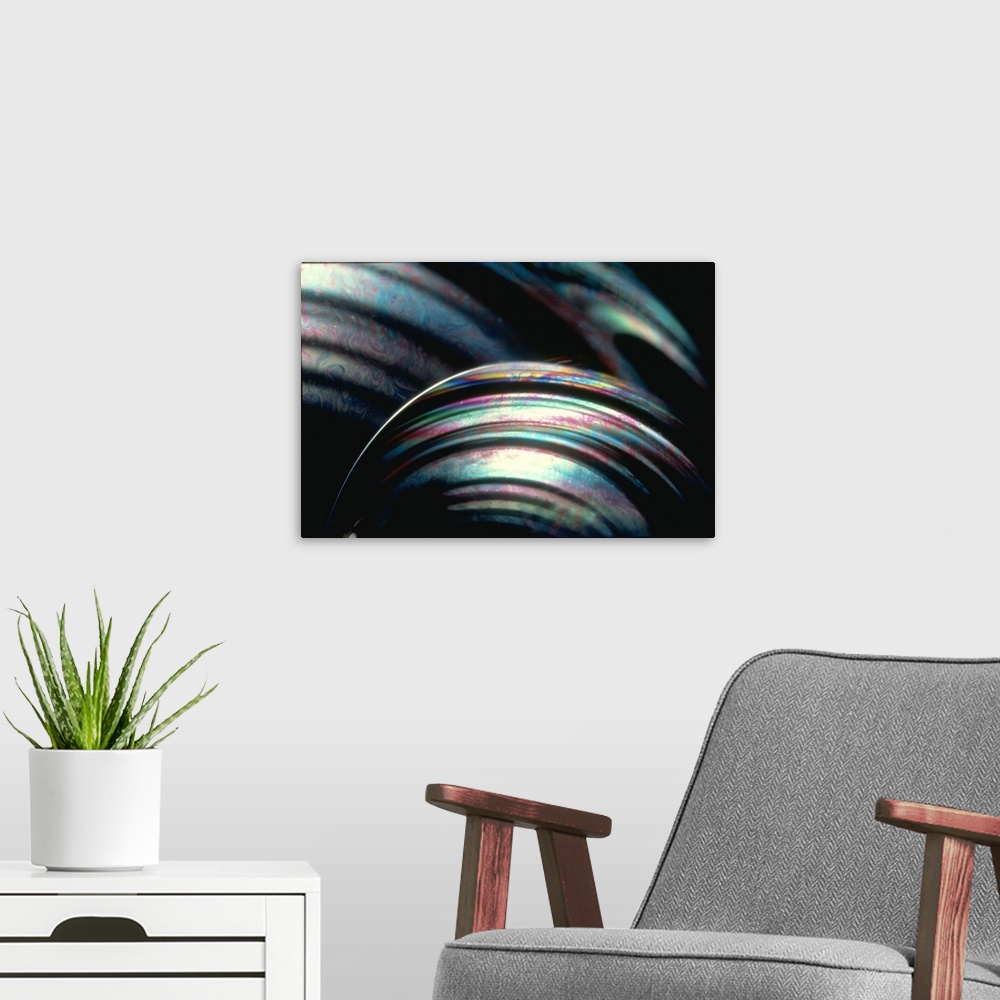 A modern room featuring This large piece shows a very close up shot of bubbles with an array of colors swirling throughout.