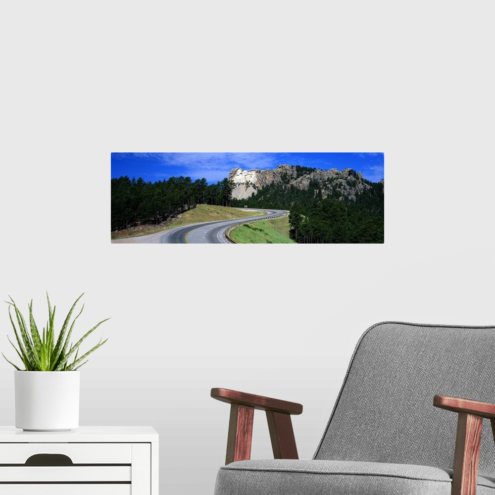 A modern room featuring A panorama of South Dakota's famous sculpture Mount Rushmore.