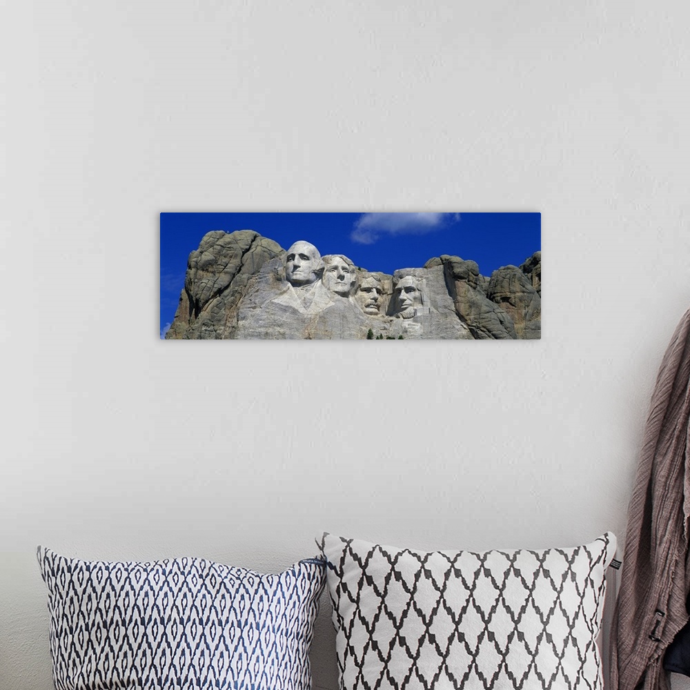 A bohemian room featuring Panoramic photo of the Mount Rushmore mountain.