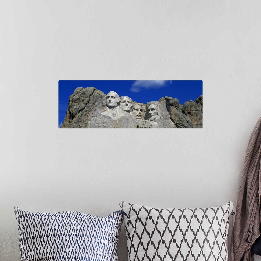 A bohemian room featuring Panoramic photo of the Mount Rushmore mountain.