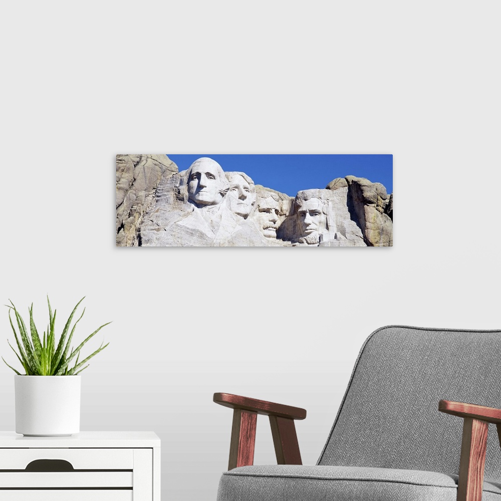 A modern room featuring A panorama of Mount Rushmore, a tribute meant to symbolize the first 150 years of American govern...