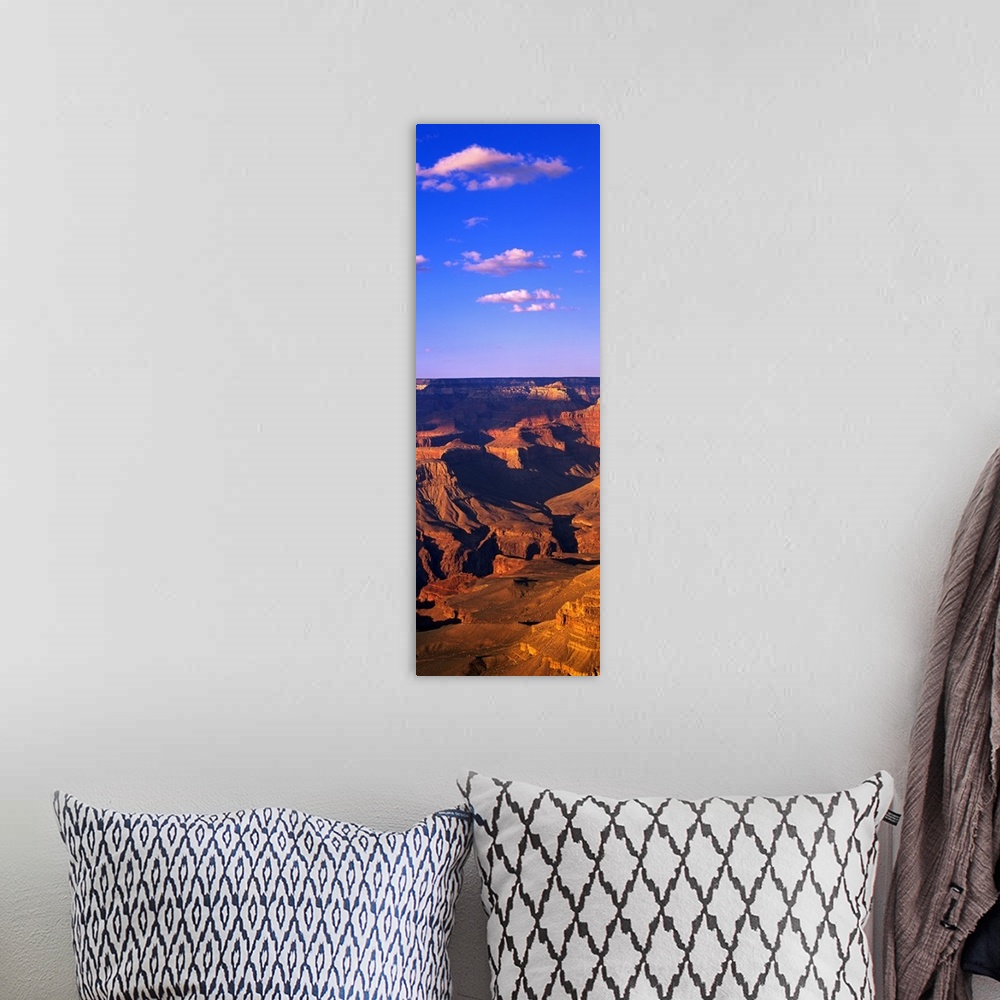 A bohemian room featuring This vertical panoramic print is a photograph taken of part of the Grand Canyon on a sunny day.