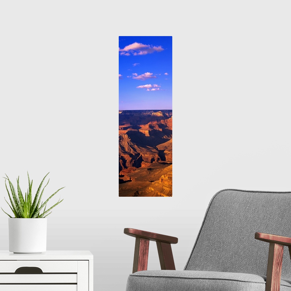 A modern room featuring This vertical panoramic print is a photograph taken of part of the Grand Canyon on a sunny day.