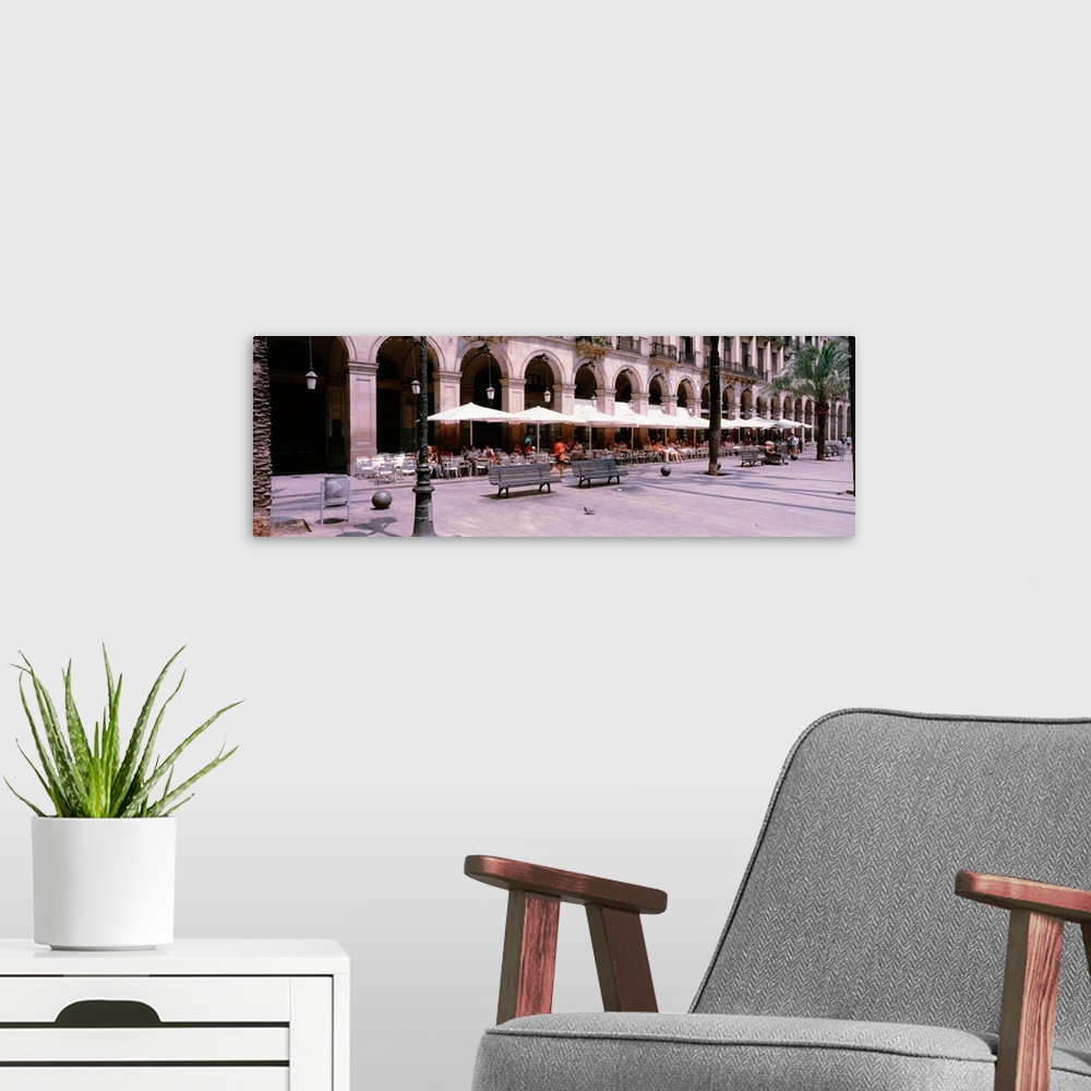 A modern room featuring Spain, Barcelona, Placa Reial, People at cafe in the Placa Reial