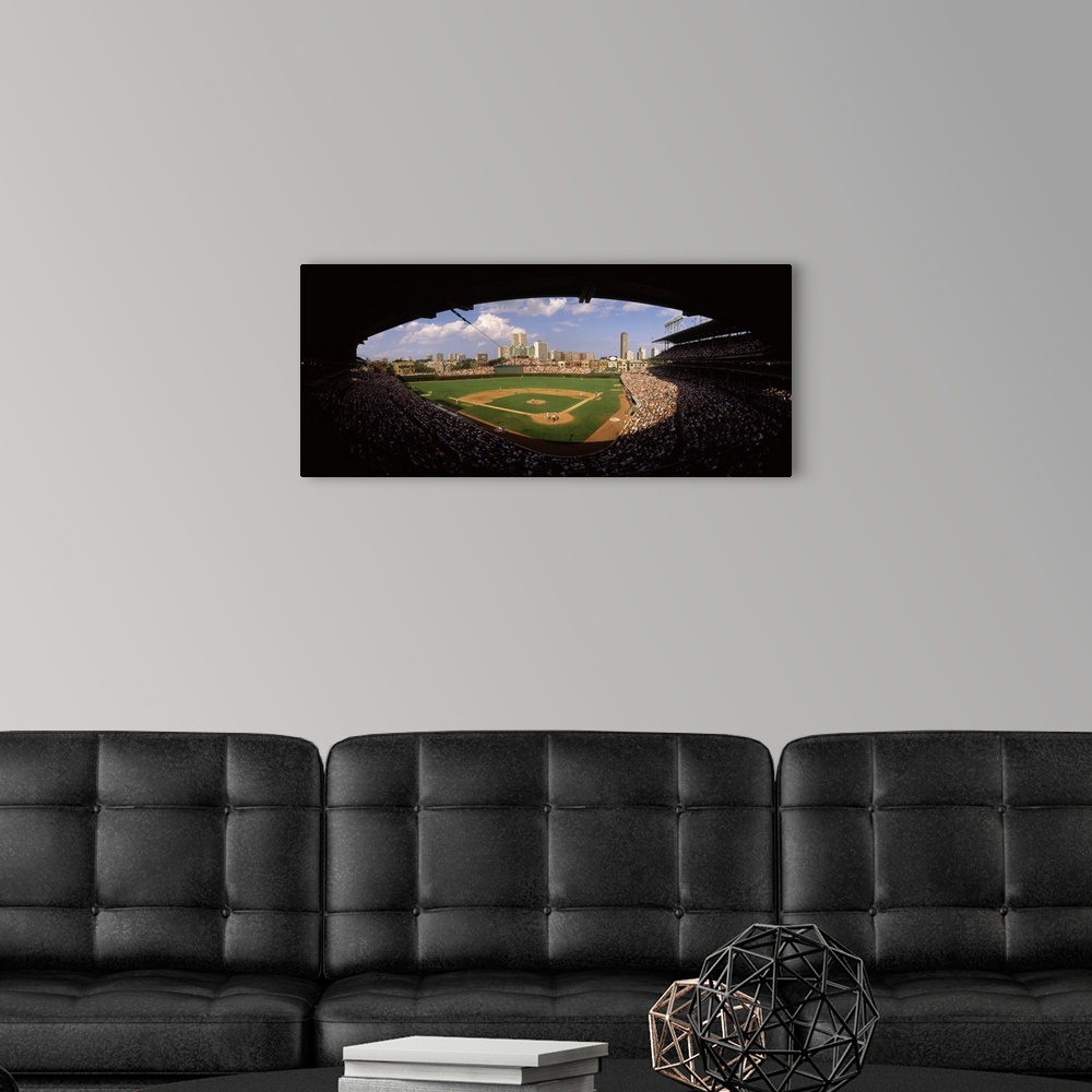 A modern room featuring Panoramic photograph taken from a section way behind home plate shows the historic ballpark and s...