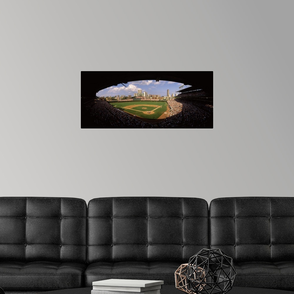 A modern room featuring Panoramic photograph taken from a section way behind home plate shows the historic ballpark and s...