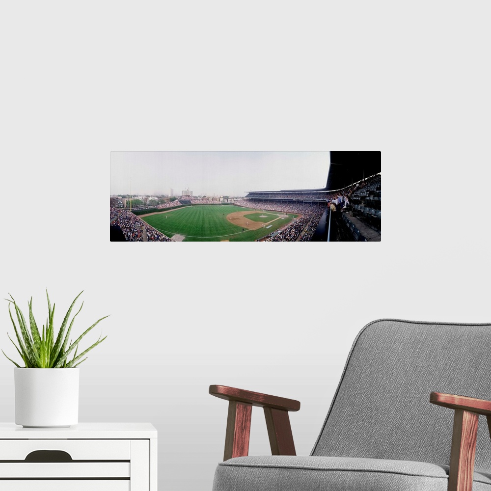 A modern room featuring Spectators watching a baseball mach in a stadium Wrigley Field Chicago Cook County Illinois